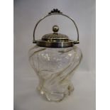 A late Victorian cut glass biscuit barrel with an applied silver lid,