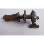 A mid Victorian Farrow & Jackson steel wine tap with an angled spout and an expandable collar,