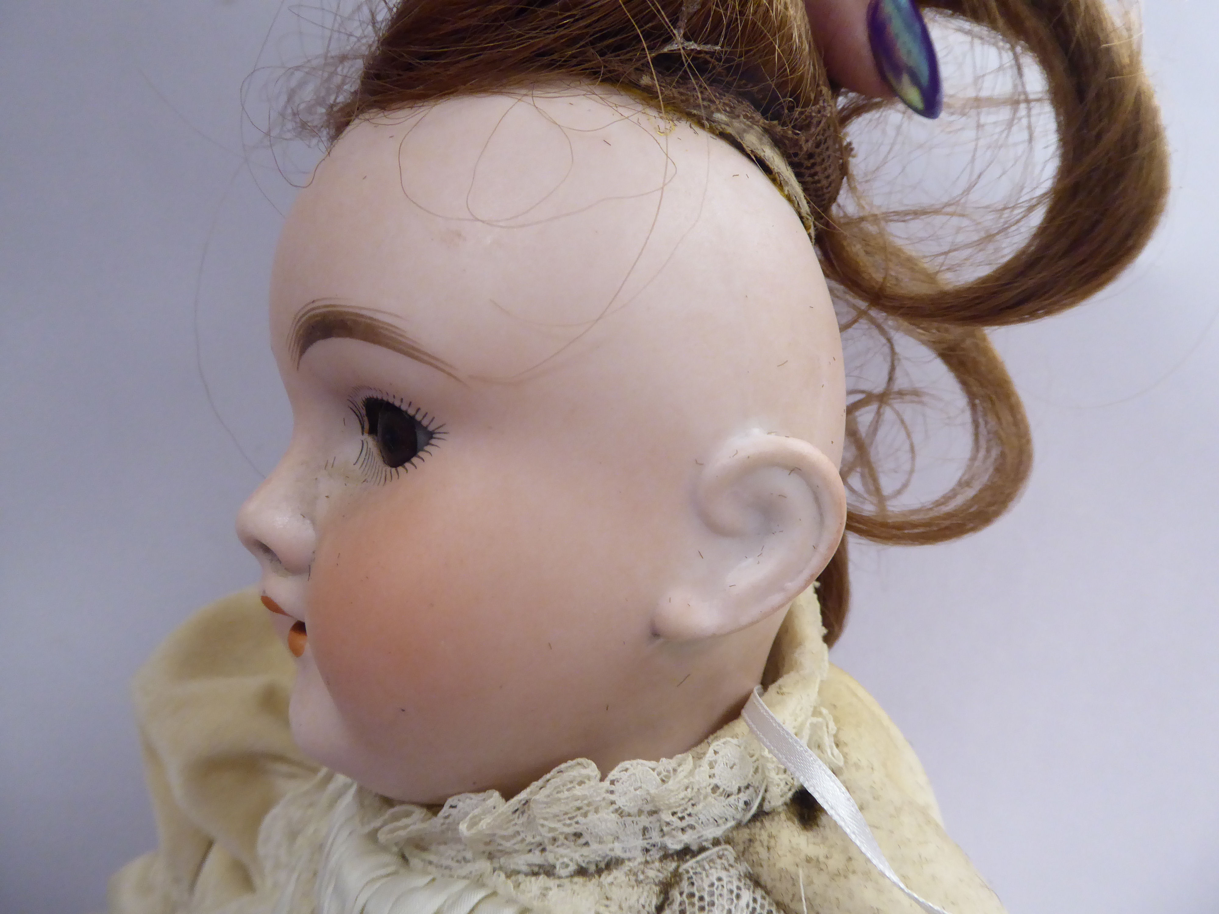 A Max Handwerck porcelain head doll with painted features and weighted, sleeping eyes, - Image 3 of 5