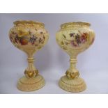 A pair of Royal Worcester blush ivory glazed china vases of bulbous form,