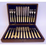 A set of twelve silver fish knives and forks with bright-cut foliate engraved ornament and bead