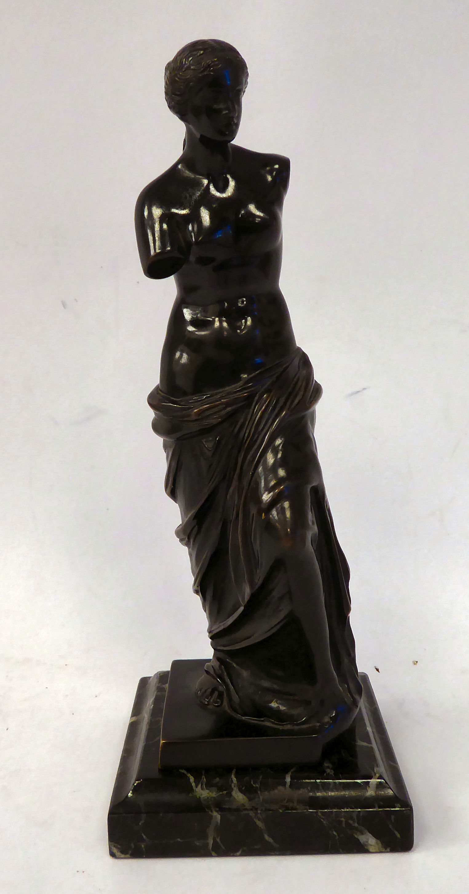 A late Victorian black patinated bronze figure 'Venus de Milo' on a marble plinth 10''h