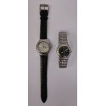 Two 1980s Swatch stainless steel cased wristwatches, one with a silvered Arabic dial,