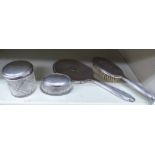 Four similar silver backed dressing table items: to include a hand mirror mixed marks OS3