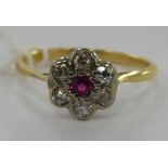 A gold coloured metal floral design ring,