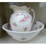 A late Victorian china wash bowl and jug,