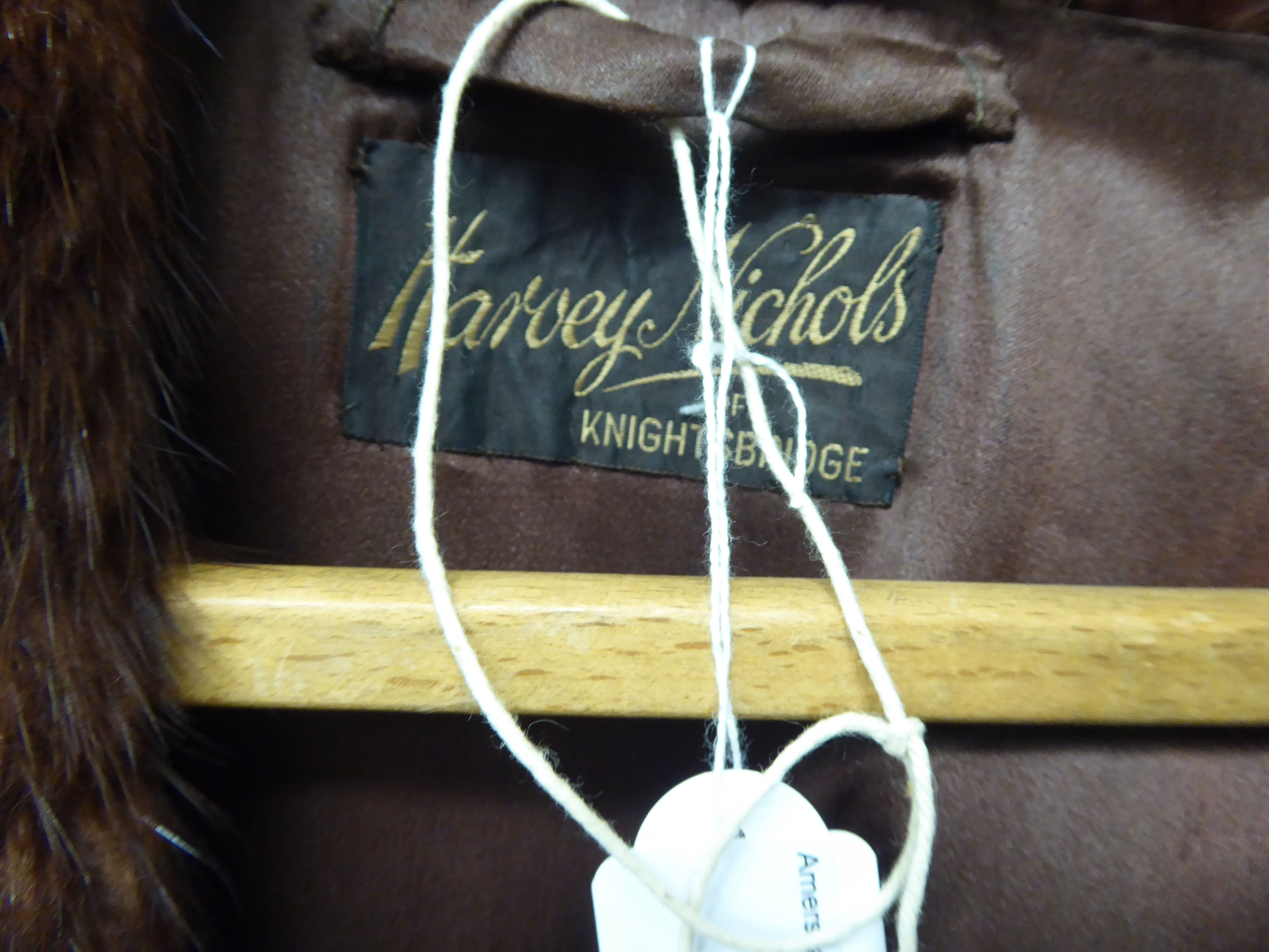 A two-tone brown mink coat with a silk lining bearing a 'Harvey Nichols, - Image 2 of 2