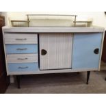 A 1960s blue and grey laminated dressing table with four drawers/two sliding doors,