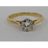 An 18ct gold claw set diamond solitaire ring 11