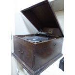 A 1930s oak cased HMV gramophone 12''h 15''w CA