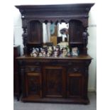 A late Victorian Dutch inspired profusely carved oak sideboard,