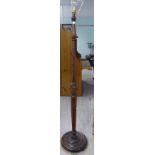 A modern stained beech standard lamp with a turned column,