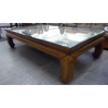 A modern Chinese fruitwood coffee table, the top with an inset woven cane panel,