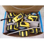 A box of twelve Hika 5 meter tape measures OS1