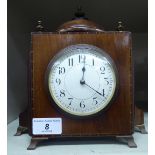 An Edwardian string inlaid mahogany mantle timepiece; the movement faced by an Arabic dial,