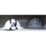 A World War II white and black painted warden's helmet;