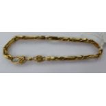 A 9ct gold bar and ropetwist link bracelet with a lobster claw clasp 11