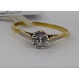 An 18ct gold claw set solitaire ring,