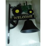 A cast metal door bell, fashioned as a tractor,