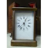 A mid 20thC brass cased carriage timepiece;
