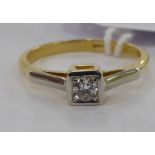An 18ct gold bi-coloured diamond solitaire ring 11