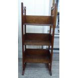 A 1920s oak three tier open front bookcase,