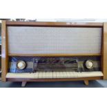 A 1960s Orion Type AR 612 mahogany finished cased mains radio with cream coloured plastic buttons
