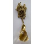 A 9ct gold pendant with a citrine,