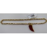 A 9ct gold bar and ropetwist link neckchain with a red stone,