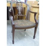 An Edwardian string inlaid mahogany framed open arm salon chair,
