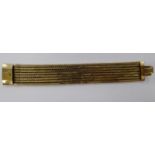 A 9ct gold eight row herringbone link articulated bracelet 11