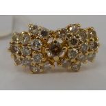 A 14ct gold diamond set cluster ring 11