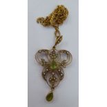 An Art Nouveau 9ct gold pendant, set with peridot and seed pearls,