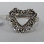 A 9ct white gold heart shaped ring,