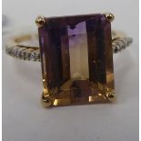 A 9ct gold ring, set with a central tourmaline,