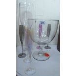 An oversized glass pedestal wine glass vase 14''h; another similar 20''h;