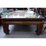 A modern Chinese fruitwood coffee table, the top with an inset woven cane panel,