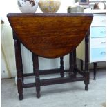 Early/mid 20thC furniture: to include a pair of stained oak bar back chairs with carved ornament