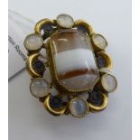 A Scottish yellow metal brooch, set with a banded agate tablet,