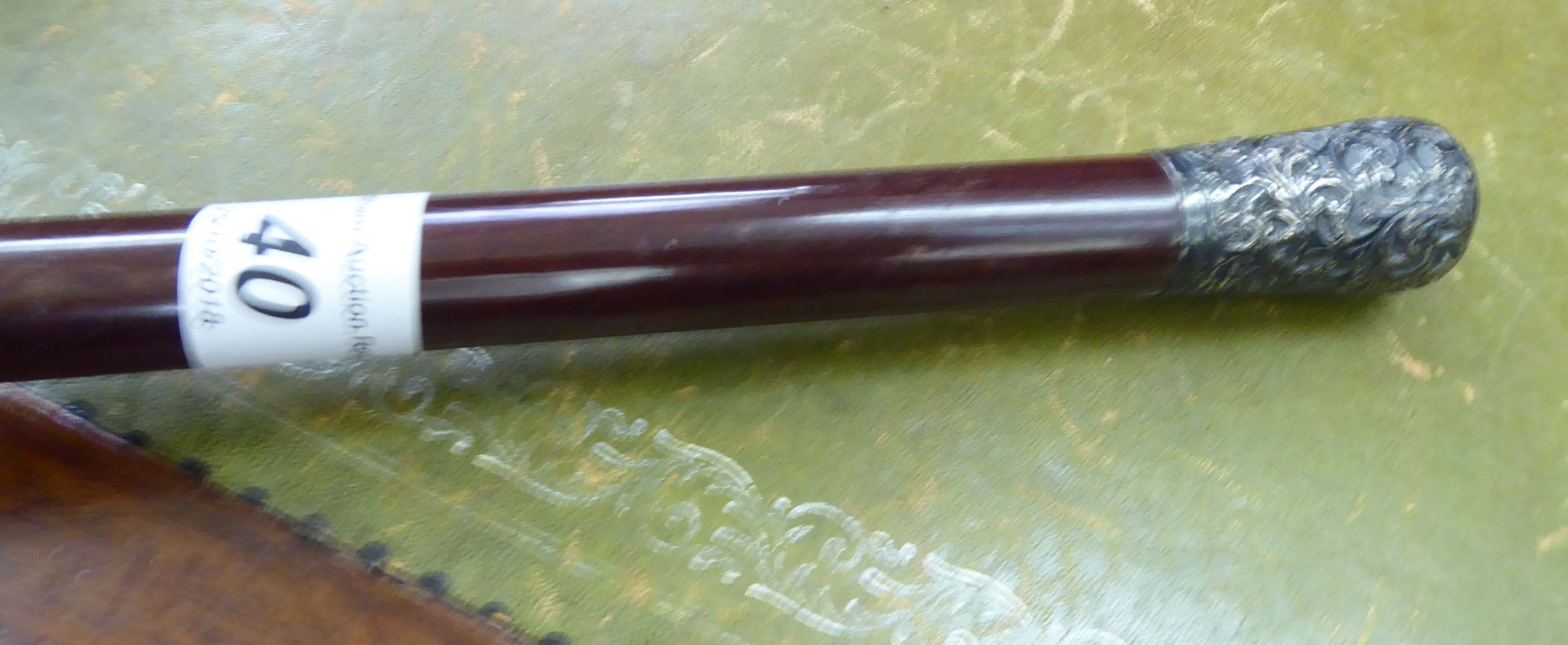 A late 19th/early 20thC walking cane with a tapered, lacquered shaft and a foliate scrolled, - Image 2 of 2