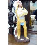 A painted composition figure, a Native American,