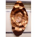 Jason Mernick - a sculptured piece of copper effect wall art,