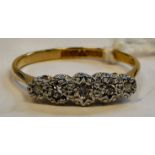 An 18ct gold five stone claw set diamond ring 11