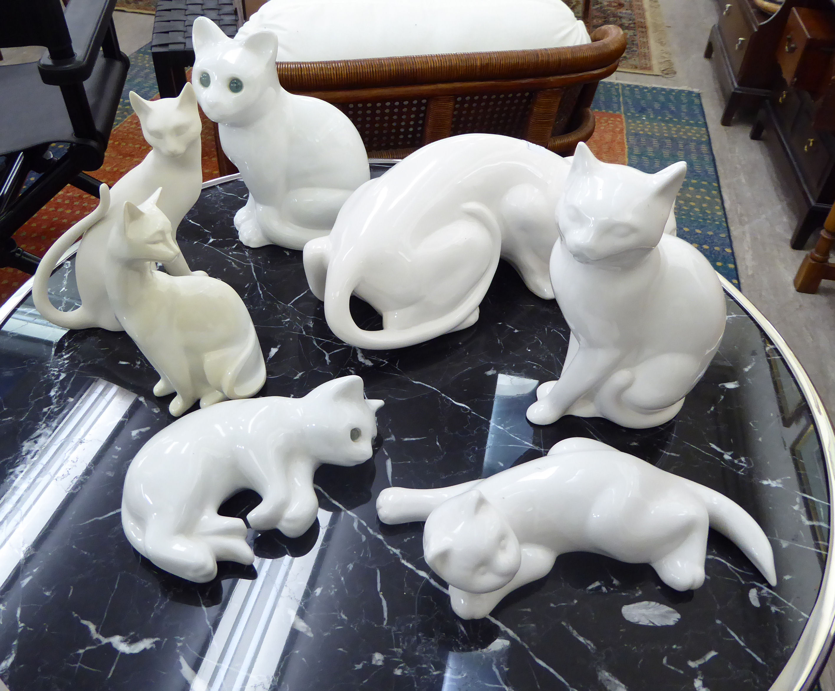 Variously made ceramic cats,
