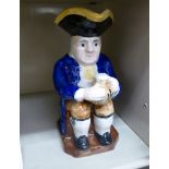 An early 19thC style china Toby jug,