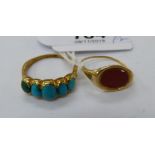 A turquoise set gold coloured metal ring;