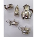 A three piece silver condiments set; a matched mustard pot;