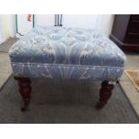 A Ralph Lauren footstool, the pale blue floral, stud upholstered top raised on turned,