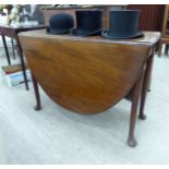 A George III mahogany drop-leaf dining table,