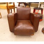 A mid 20thC child's stud upholstered brown faux hide armchair,